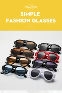 Detail of trendy retro oval sunglasses with metal studs and various colorful lenses