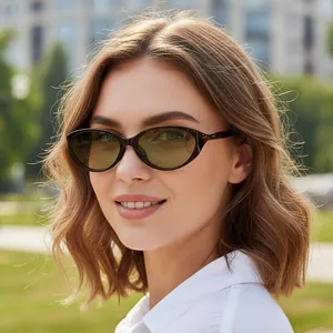 Retro oval tortoiseshell sunglasses with yellow lenses worn outdoors for stylish sun protection