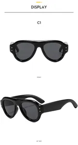Detail of retro oval black sunglasses with gold rivets showing front and 45-degree side views