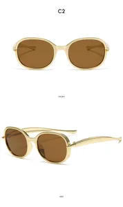 Vues de face et de côté de lunettes de soleil vintage dorées pour enfants avec verres bruns