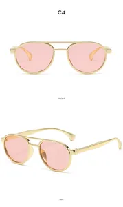 Detailed front and side views of gold double-bridge retro kids sunglasses with pink lenses