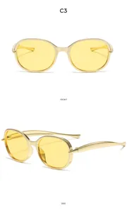 Vues de face et de côté de lunettes de soleil vintage C3 pour enfants, monture dorée et verres jaunes