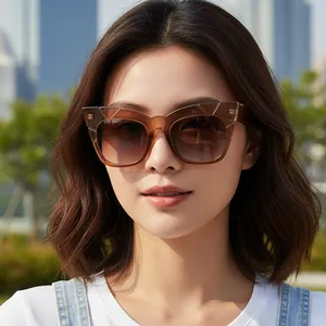 Vintage oversized cat-eye sunglasses with translucent amber frames and gradient lenses