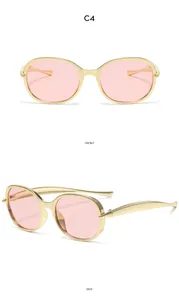 Vues de face et de profil de lunettes de soleil vintage dorées pour enfants avec verres roses