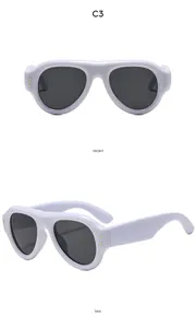 Front and side views of white thick frame oval sunglasses with golden metal rivets