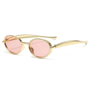 Retro oval kids sunglasses with gold metal frame and pink lenses at a 45-degree angle