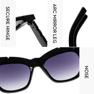 Detail view of secure metal hinges and arc mirror legs on oversized cat-eye sunglasses