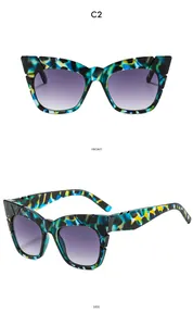 Front and side views of oversized camo cat-eye sunglasses with purple gradient lenses
