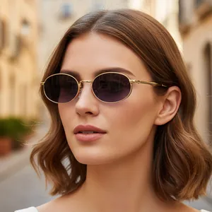 Retro oval gold metal sunglasses with purple gradient lenses worn by model on street