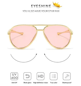 Close-up of golden aviator sunglasses for kids with UV400 pink lenses and metal frame