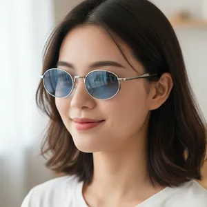 Retro oval metal sunglasses with silver frame and light blue gradient lenses for women