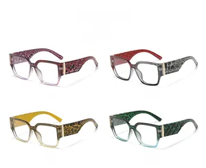 Detail view of four large square eyeglass frames with unique floral and cracked patterns