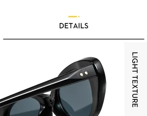 Close-up of black sunglass frame showing golden rivet details and premium light texture