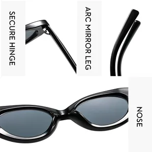 Detail view of reinforced metal hinges and ergonomic curved legs of black cat eye sunglasses