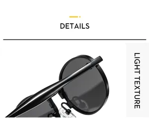 Detailed macro view of black oval sunglasses showing the hinge and smooth glossy frame
