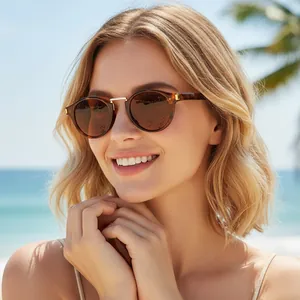 Vintage Y2K cat-eye sunglasses with tortoiseshell frame and dark brown lenses on model