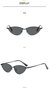 Vues frontale et latérale de lunettes de soleil œil de chat ovales rétro avec monture noire fine