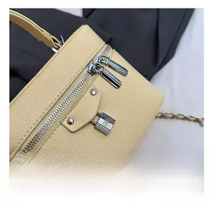 Close-up of premium lychee texture leather with silver lock and double zipper detail