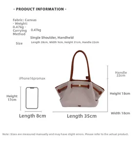 Detailed view of canvas tote bag with brown leather trim and drawstring closure details