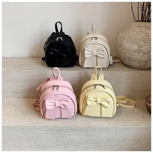 Mini PU leather backpacks in four colors featuring a large bow and double zipper design