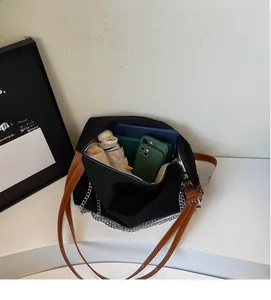 Internal view of a black tote bag showing large capacity for umbrella and tablet