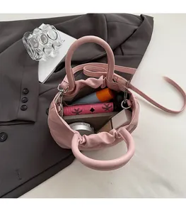 Interior view of pink pleated bucket bag showing spacious capacity for daily cosmetics