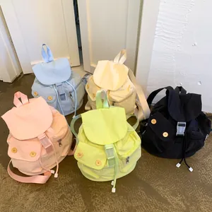 Chic nylon flap backpacks for women in pastel colors with buckle and drawstring closure