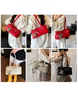 Detail shots of chic shoulder bags with lychee leather texture and heart charms