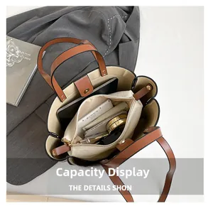 Interior detail of large brown tote bag showing capacity for tablet and cosmetics