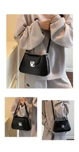 Détail du sac à main noir plissé montrant la boucle carrée argentée et la texture