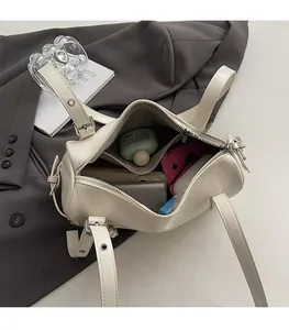 Interior view of cream pillow bag showing spacious capacity for daily essentials