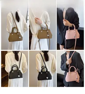 Litchi pattern leather handbags in brown, pink, and black colors with heart charms