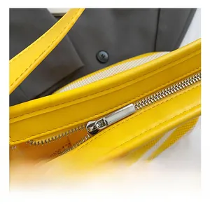 Detail of yellow woven tote bag featuring high-quality silver metal zipper closure