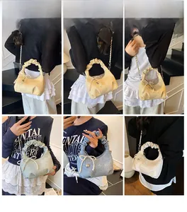 Detail shots of pleated cloud bag with pearl bow and heart charm in various carrying styles