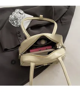 Interior view of the yellow mini bowling bag showing spacious storage for essentials