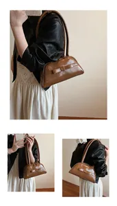 Close-up of retro brown bowling bag with elegant bow detail and dual handles