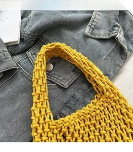 Detail of bright yellow hollow knit tote bag showing the reinforced comfortable shoulder strap
