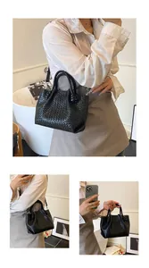 Detailed view of black woven bucket bag showing textured PU leather and knotted handle