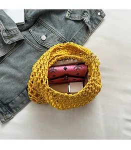 Top view of hollow knit tote bag interior showing ample storage space for a wallet and cosmetics
