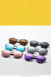 Detail showing six colorful lens options for oversized cat eye metal sunglasses