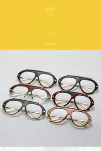 Detail of oversized geometric glasses frames in multiple colors with stylish metal top-bar