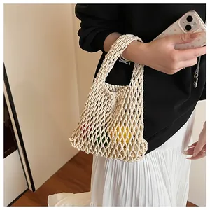 Detail of hollow knit mesh tote bag showing handmade cotton texture and load capacity