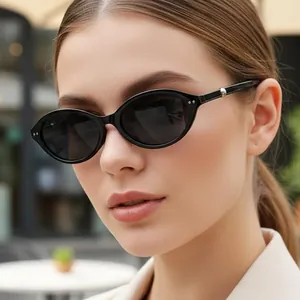 Y2K vintage black cat-eye sunglasses with oval frames and silver metal stud details