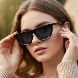 Chic black cat-eye sunglasses with thick frames and dark lenses for outdoor fashion