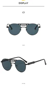 Détail des lunettes pilote C1 avec monture métallique noire à double pont et verres foncés