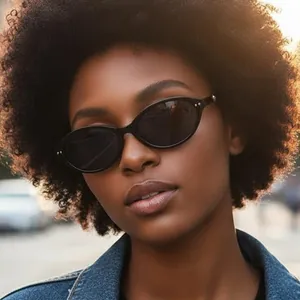 Y2K vintage cat-eye sunglasses with rice nail accents on a model wearing denim jacket