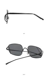 Vue latérale et arrière des lunettes de soleil punk hip hop noires à monture large