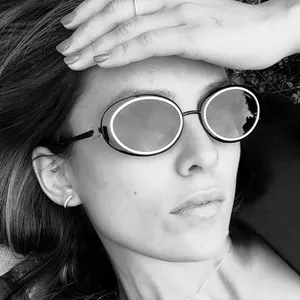 Retro oval black sunglasses with thick frames and brand logo for outdoor vacation fashion