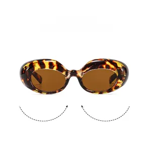 Detailansicht einer ovalen Schildpatt-Sonnenbrille mit dunklen Gläsern und dickem Rahmen