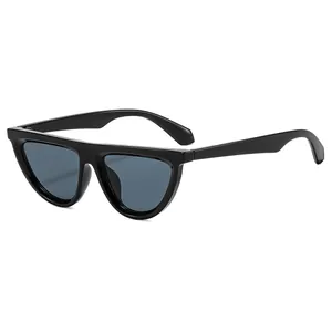 Retro cat-eye sunglasses with black frame and grey-blue lenses from 45-degree angle